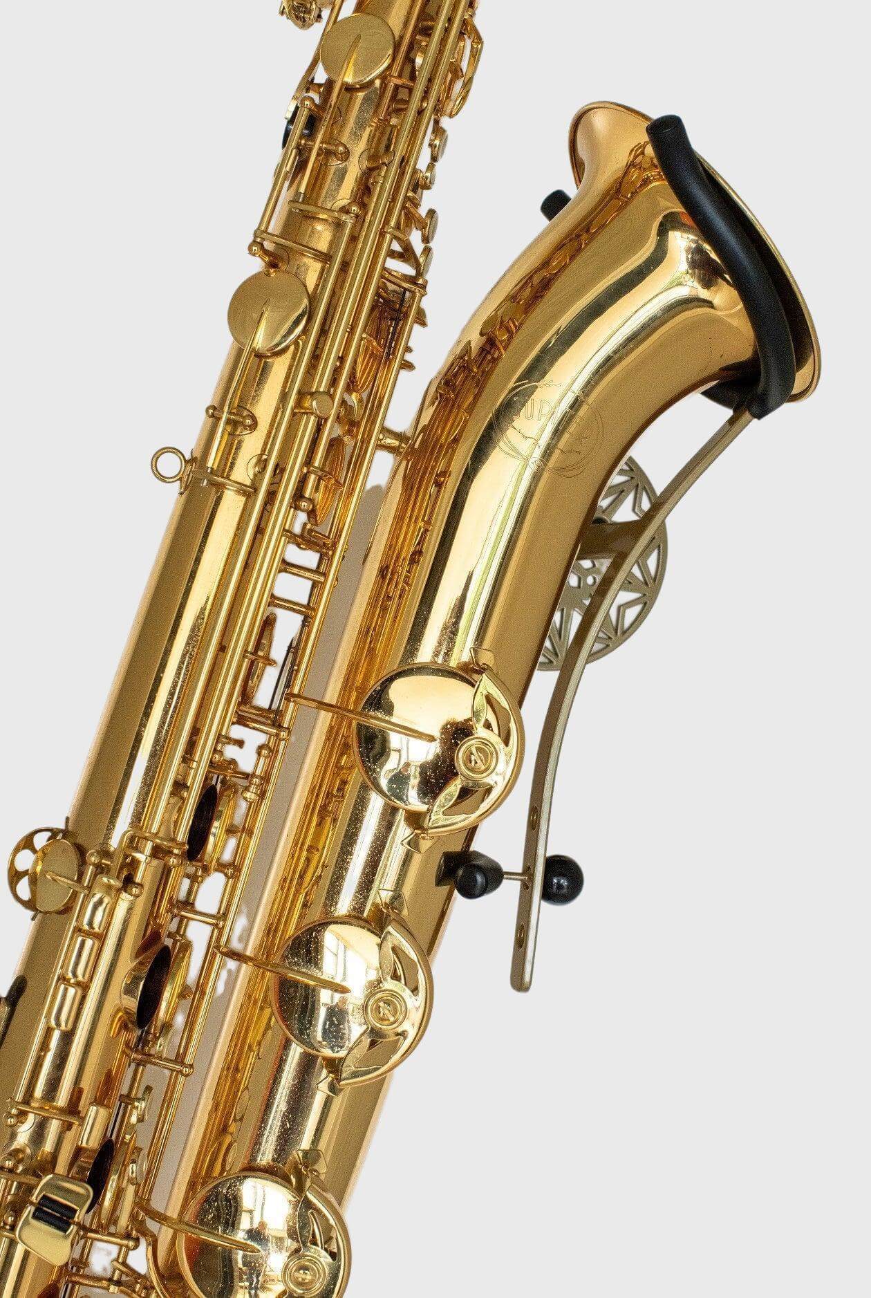 gold baritone saxophone in wallmount Samba Bronze on white wall by Locoparasaxo.com