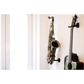 customer interior pic white wall with tenor saxophone next to guitar in Locoparasaxo wall-mounted stand