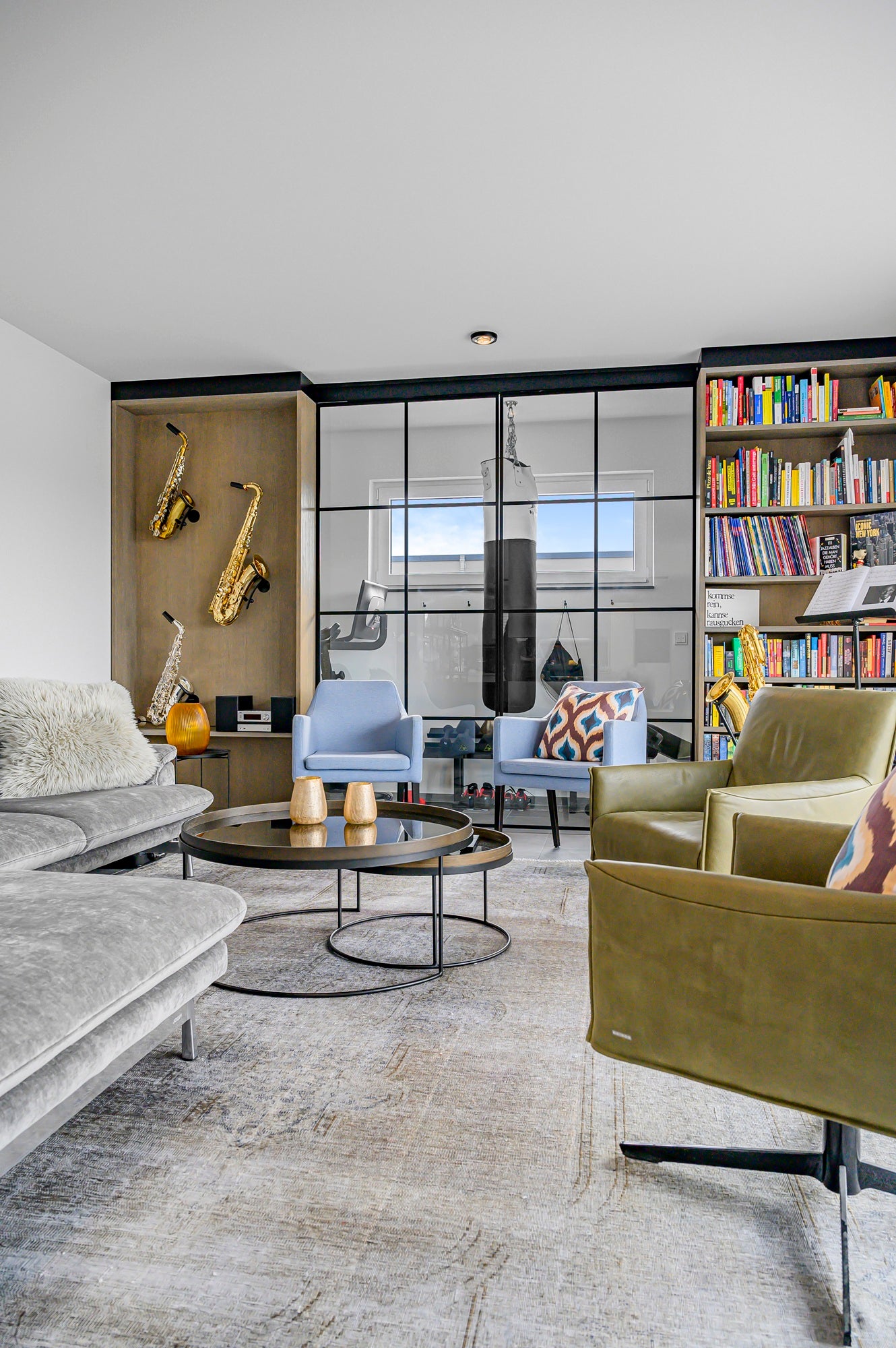 modern livingroom with wall mounted saxophones and bookcase