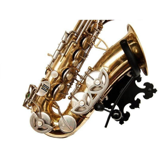 alto saxophone in stand with decorative wall plate Prince on white backdrop Locoparasaxo product pic