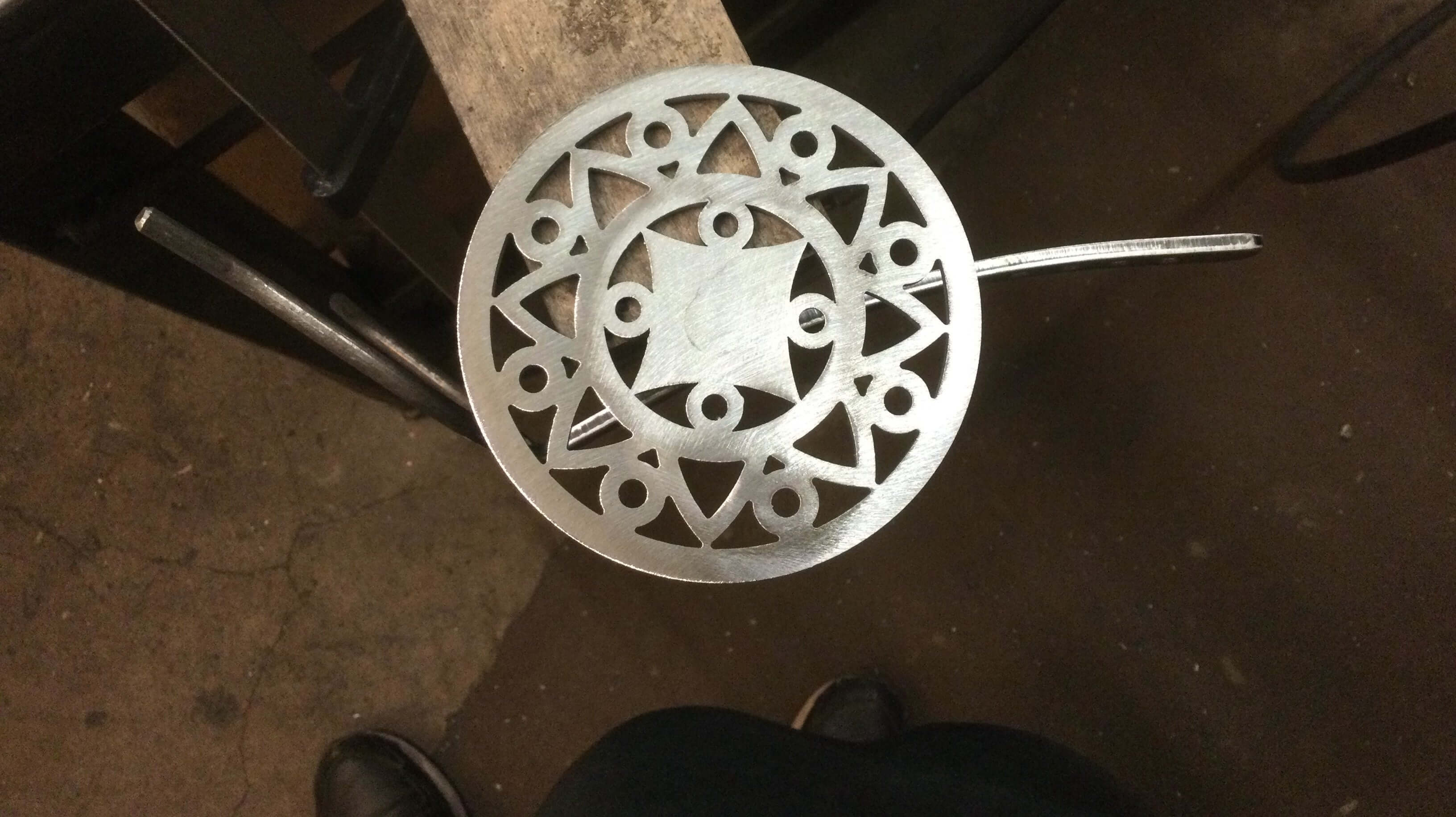 hand showing detail unfinished saxophone stand