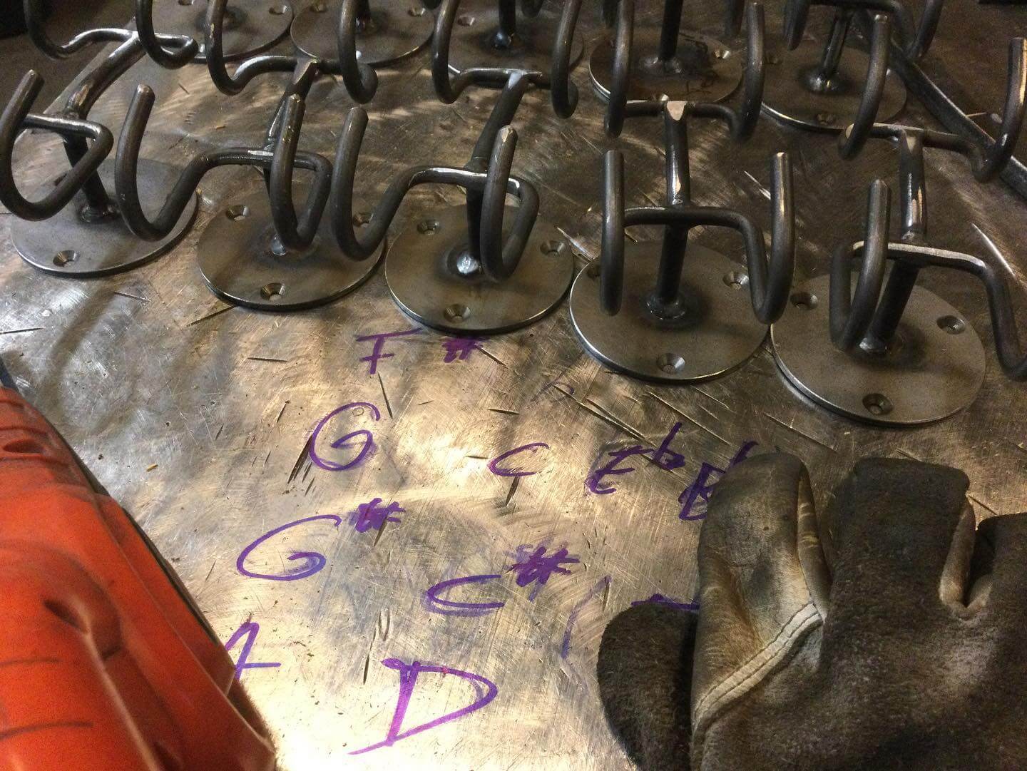 workbench with 8 welded unfinished trombone wall stands fullsize pic