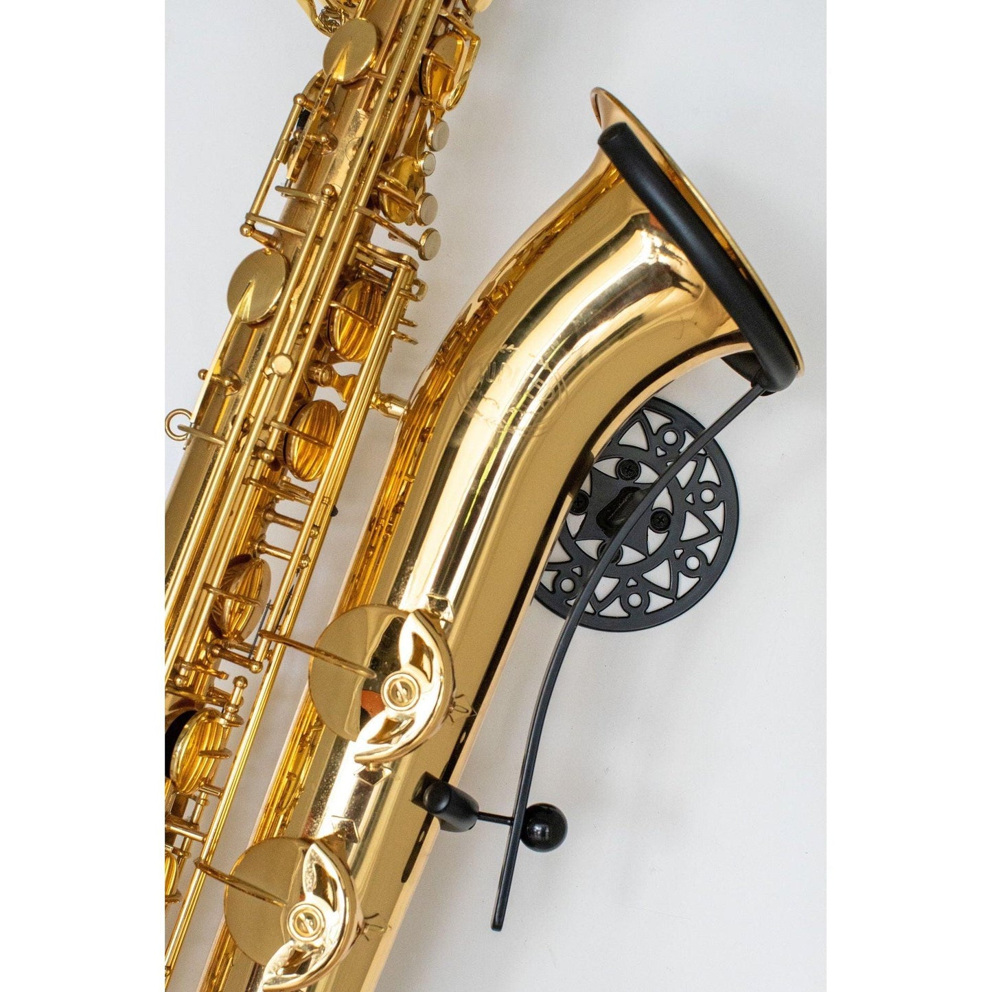 gold baritone saxophone in wallmount Aztec on white wall by Locoparasaxo.com