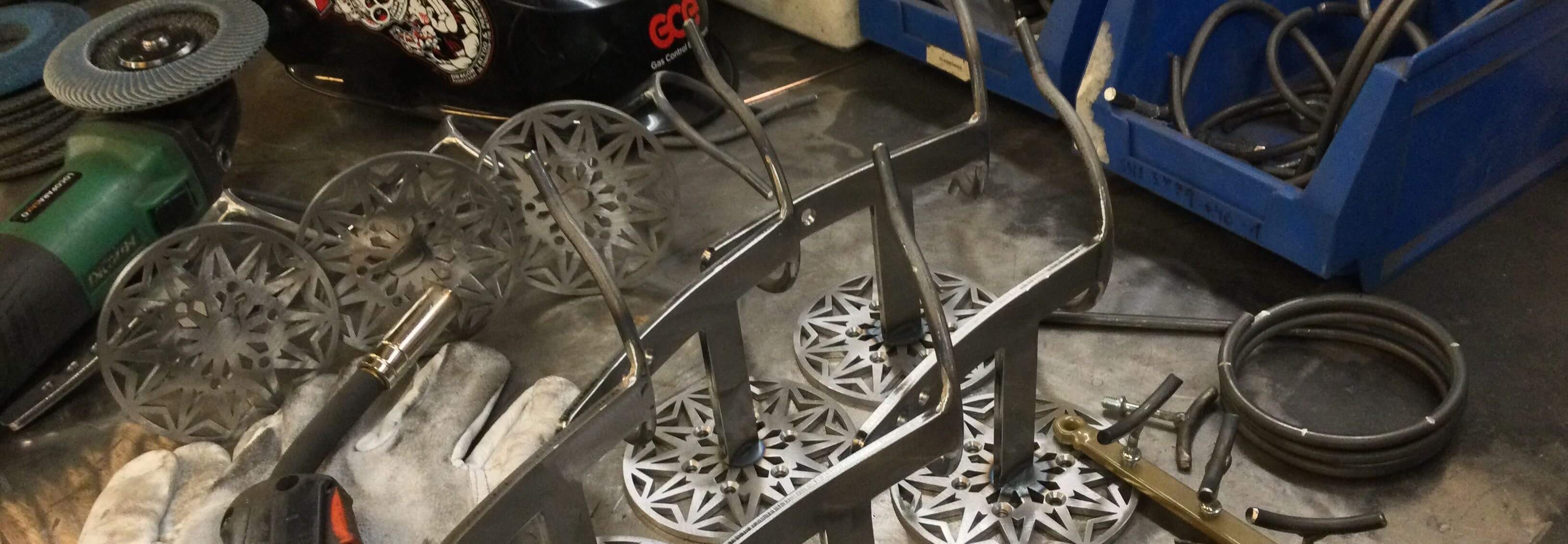stands in the making on a steel workbench