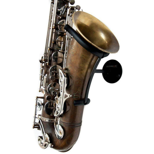 angled view tenor saxophone brass and chrome valves resting in black steel wallmounted stand for saxophone Soul Prop on white backdrop, locoparasaxo product picture
