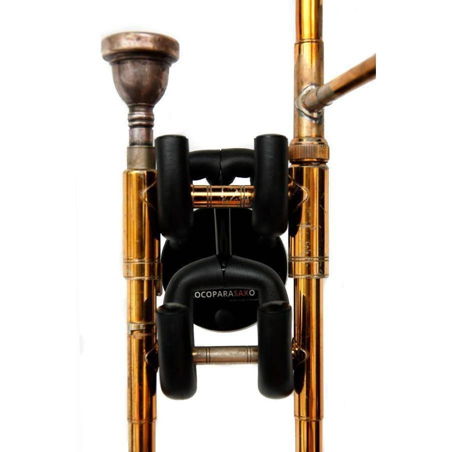 frontal close up trombone on white wall in black wallmounted stand by Locoparasaxo