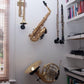 french horn, saxophone, trumpet, flute, clarinet, all mounted in stands by locoparasaxo on a  home wall
