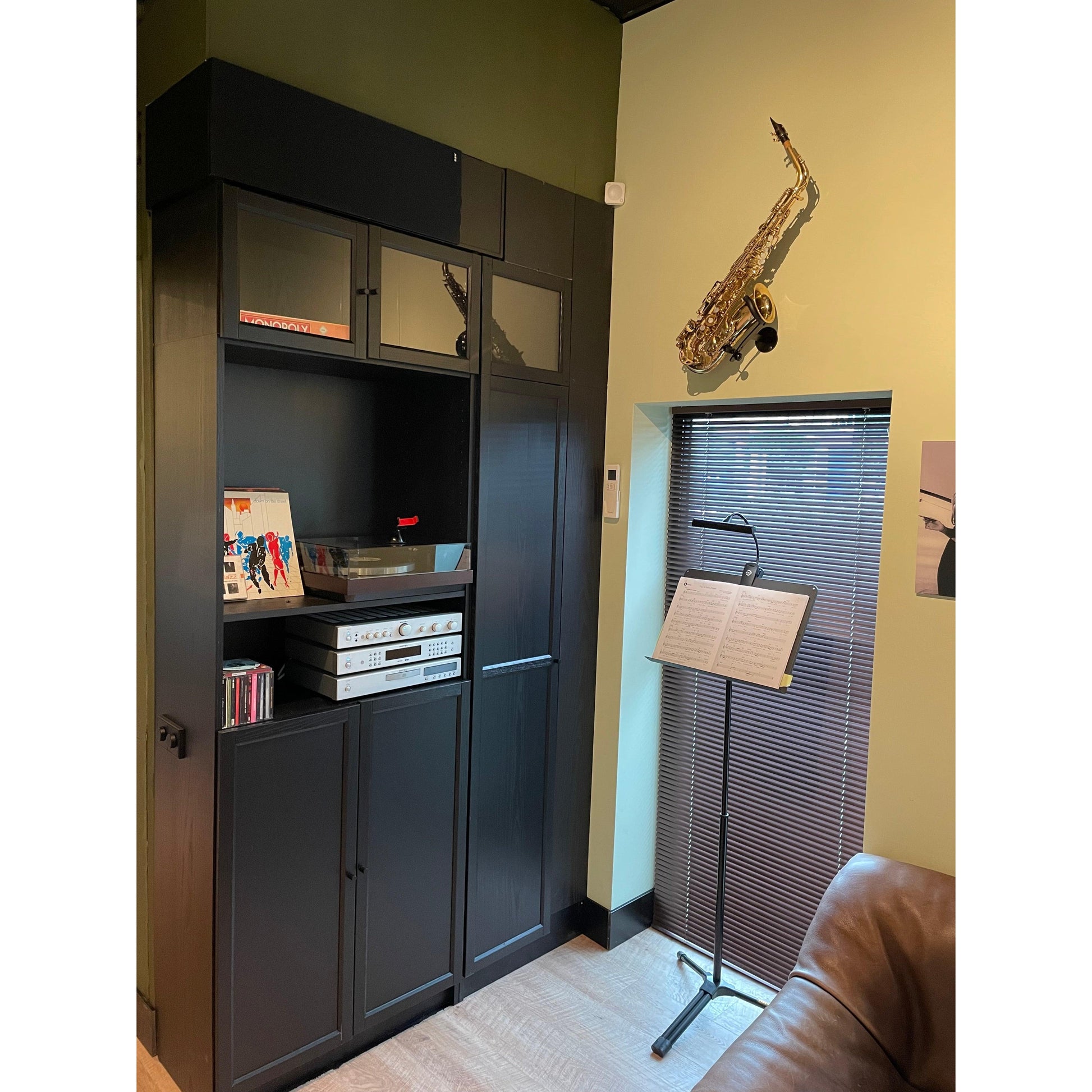 music room of Locoparasaxo customer with music stand recordplayer and wallmounted alto saxophone 