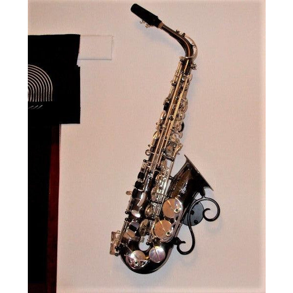customer sent picture of alto saxophone in OneTrick Pony stand by Locoparasaxo on white wall