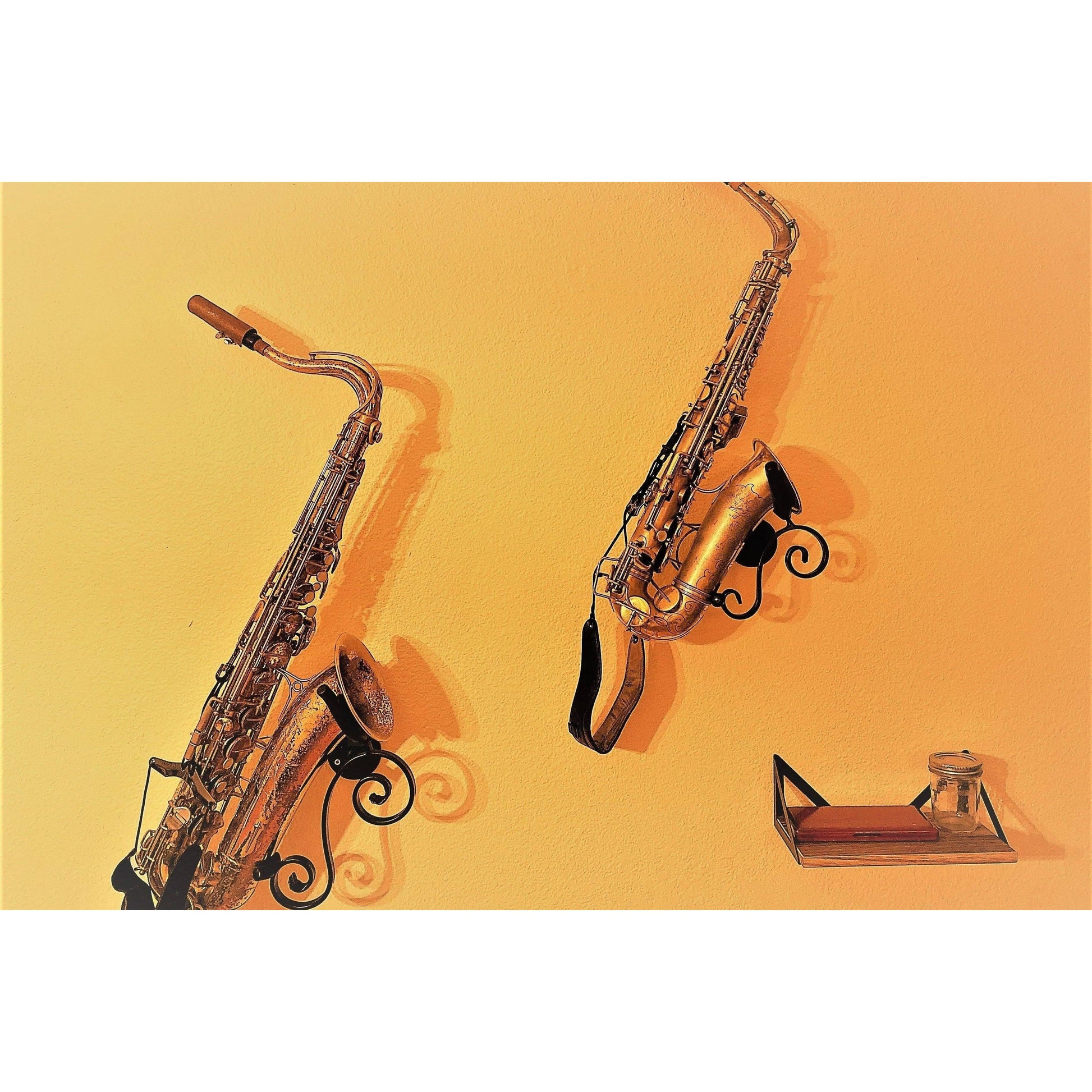 grainy customer made picture of two saxophones in bespoke saxophone  stands made by Locoparasaxo on yellow wall